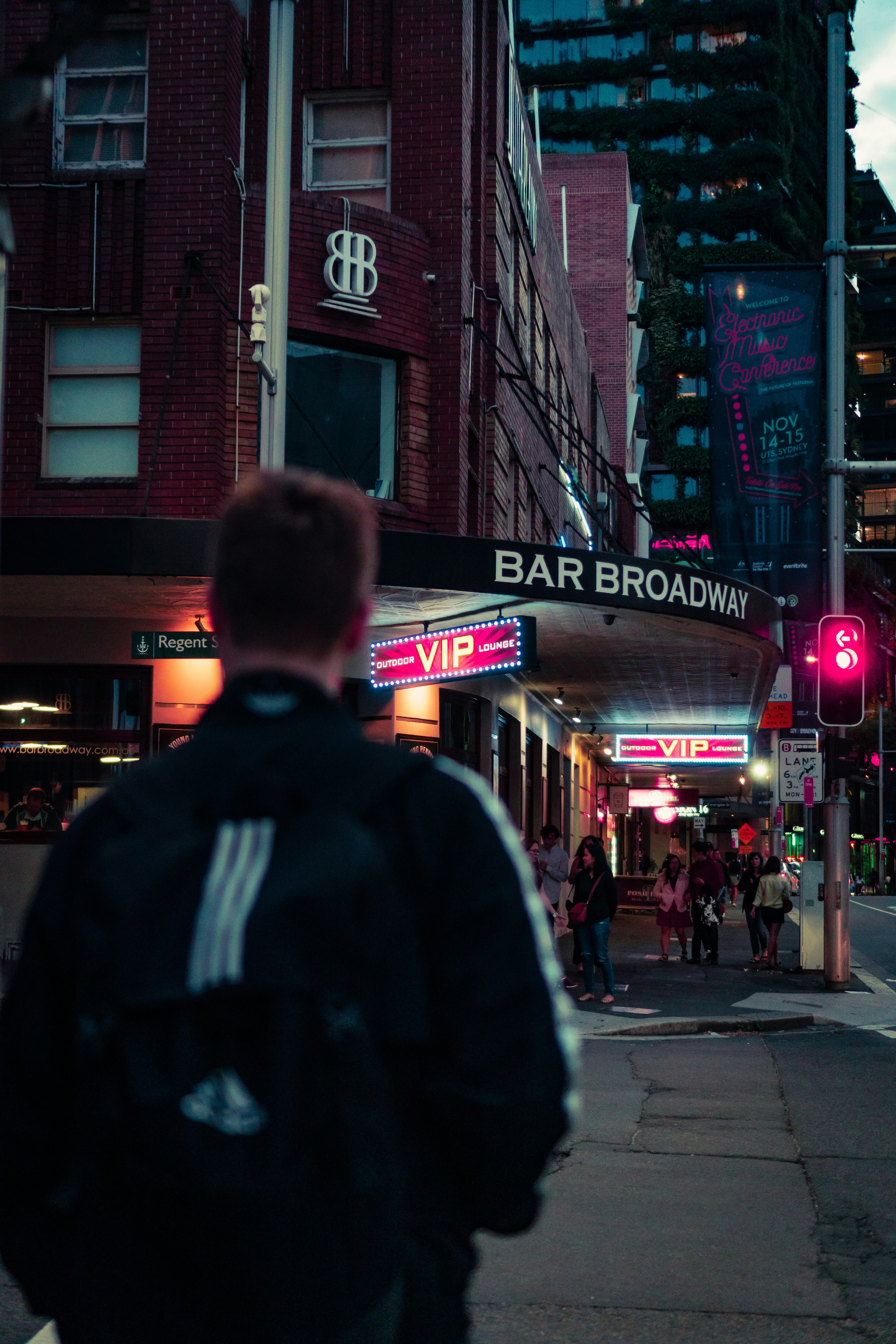 man walking towards bar broadway